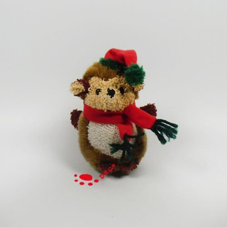 Mini singe de Noël en peluche